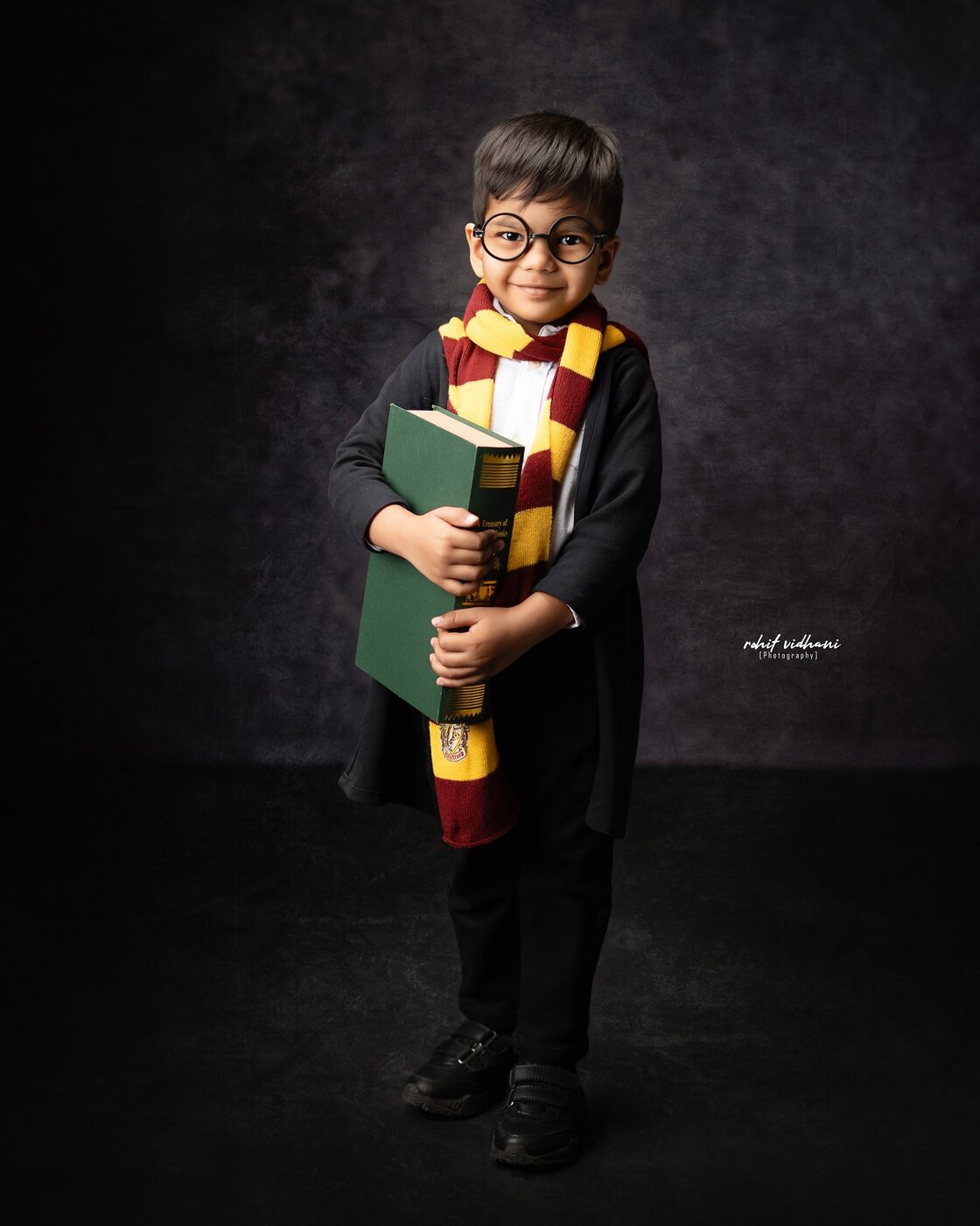 Kids Harry Potter themed photoshoot with books and globe