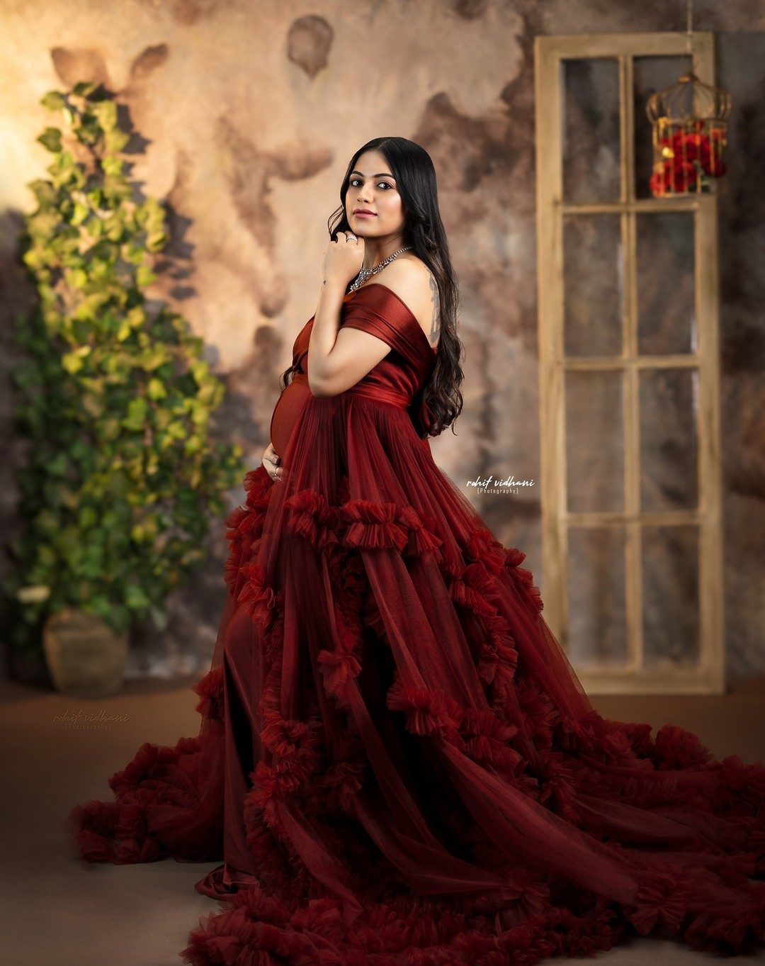 Maternity solo portrait, maroon ruffle gown
